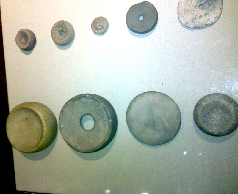 Stone discoidals (chunkey pieces) — Slone yielded 150+ discoidals; museum examples from Ohio Fort Ancient collections (not Slone artifacts)